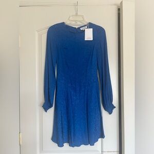 Brand new bright blue dress with long sleeves
